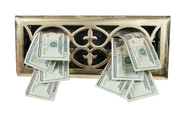 Ornate heating vent cover and money representing energy loss