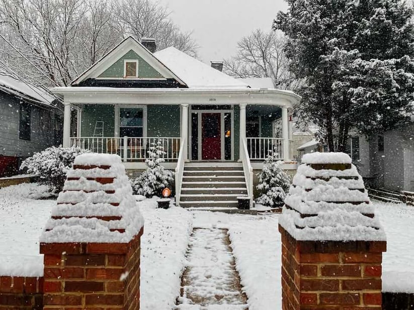 green-and-white-house-in-snow-1