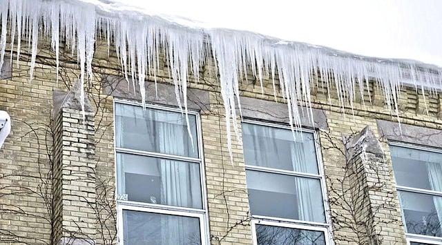 icicles can cause harmful ice dams on houses