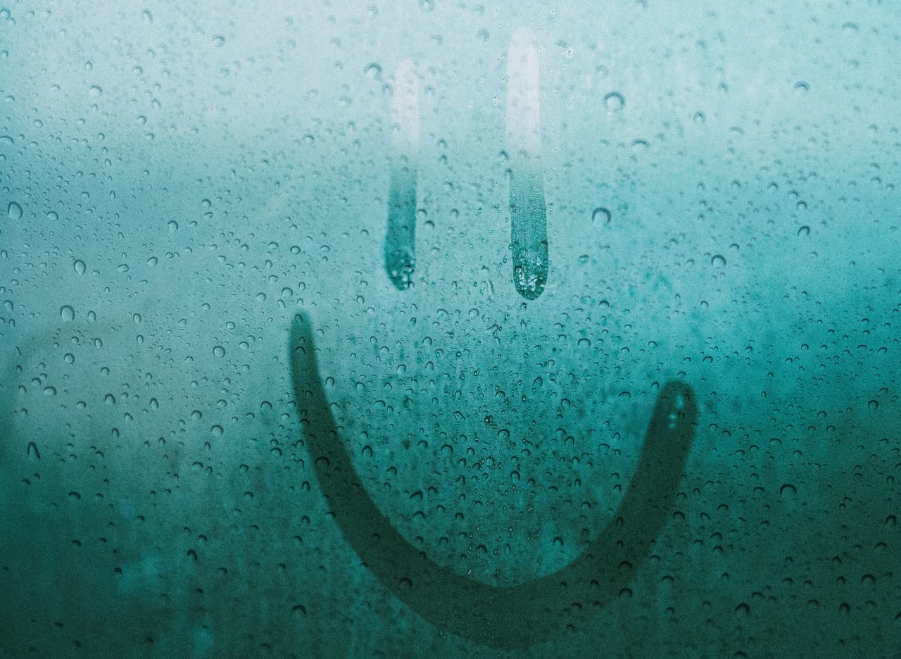 smiley-face-in-condensation-on-window