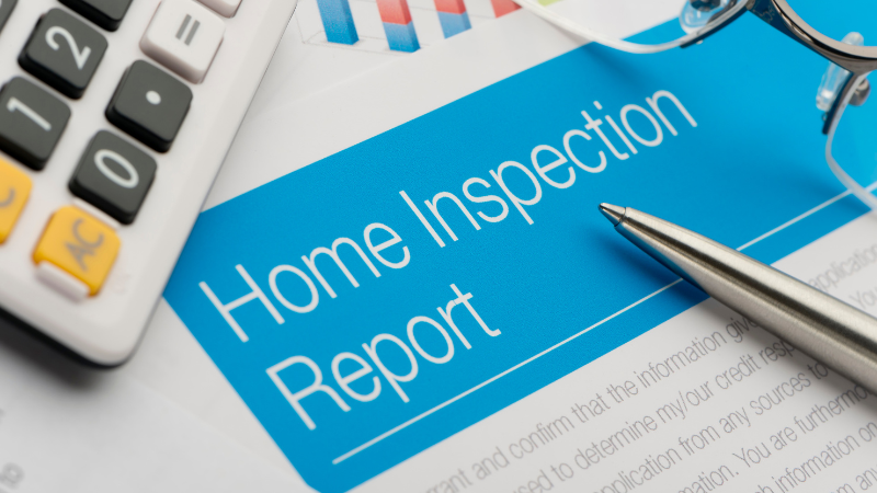 Inspection report with calculator and pen