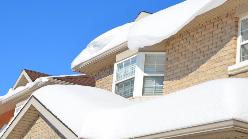 Home with a lot of snow on roof