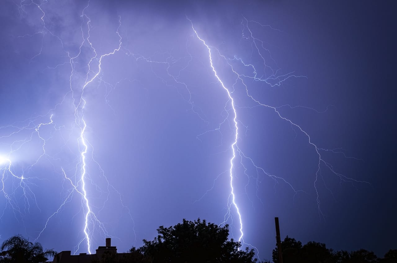 lightning-bolts-against-dark-blue-sky