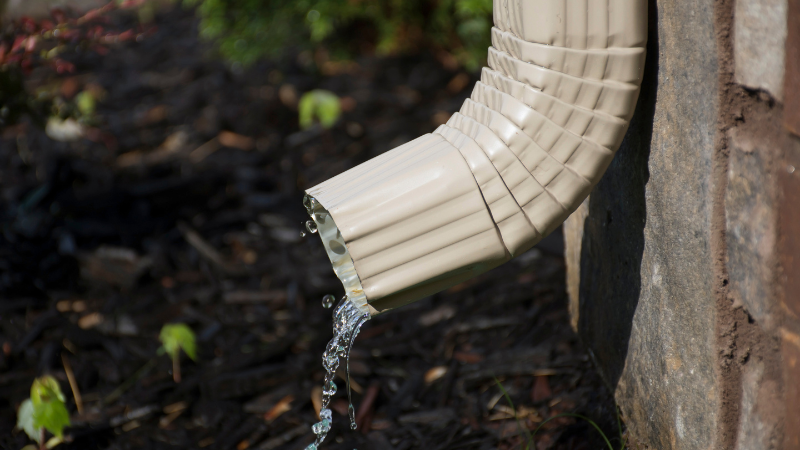home downspout with water