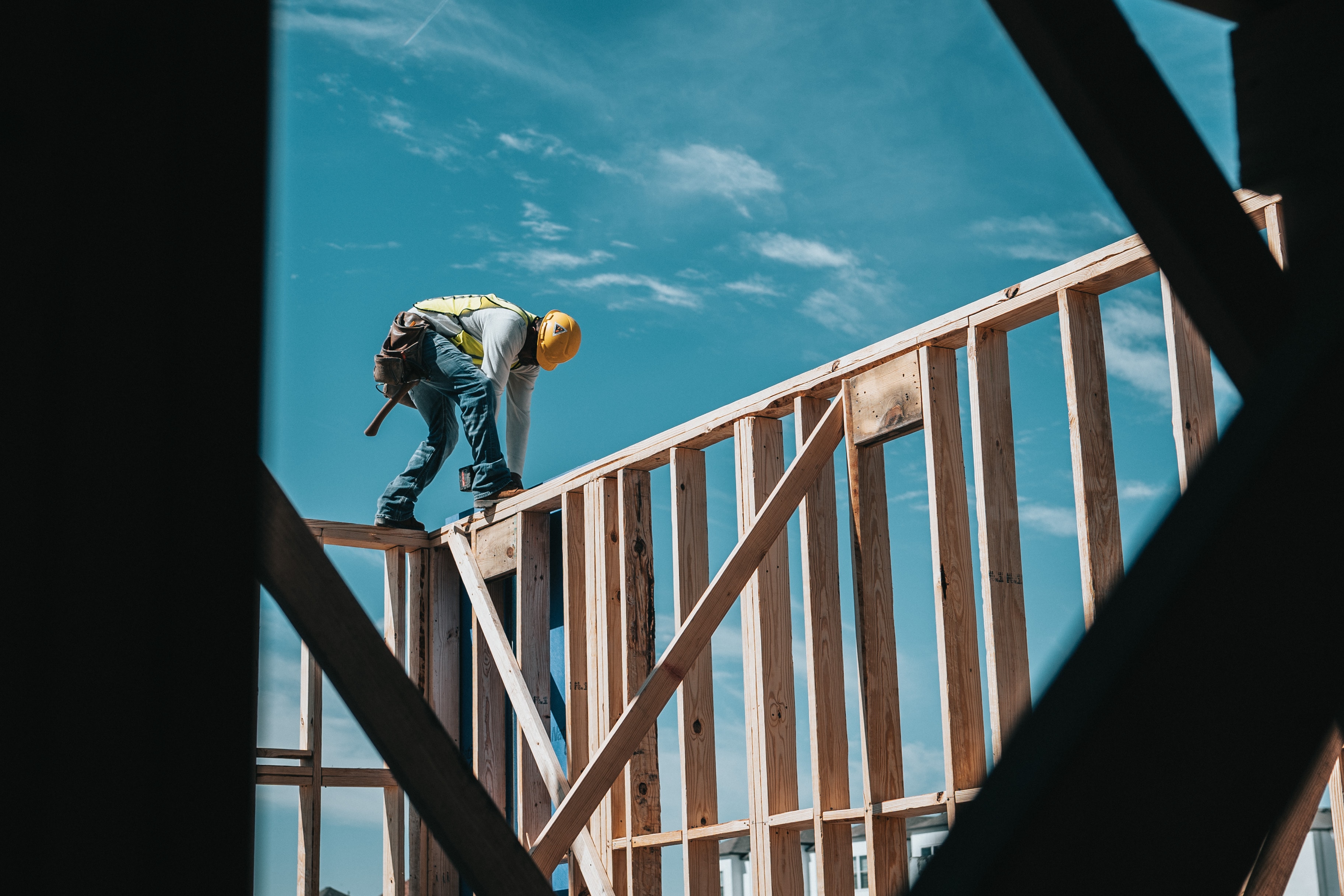 home-construction-framer-working-on-home-unsplash