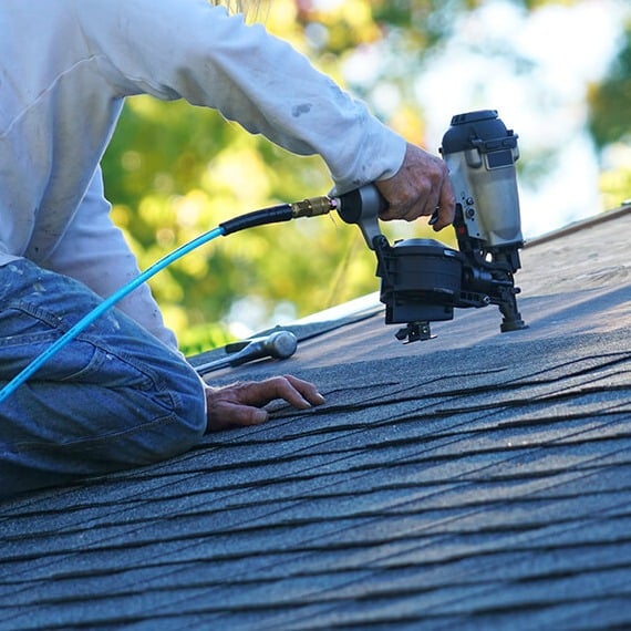 man-repairing-roof