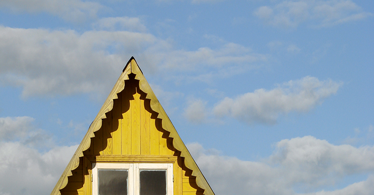 Pointed-roof-blue-sky-clouds